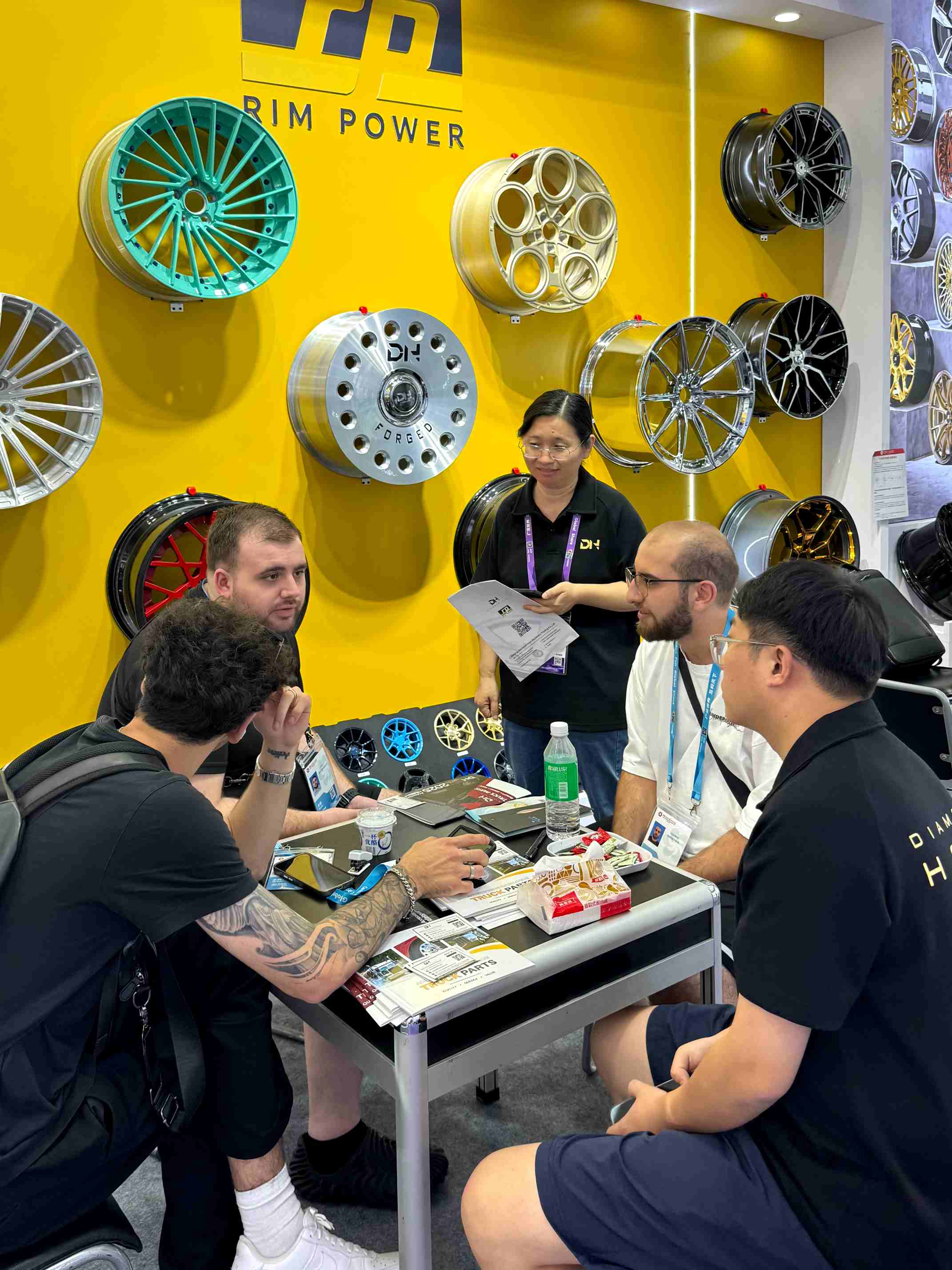 RimPower team discussing forged wheel projects with international visitors